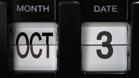 Flip calendar with a date change from third October to fourth October. close up. Stock Footage 270853446