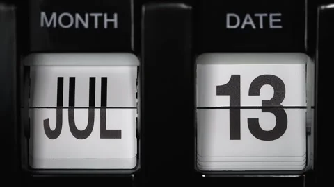 Flip calendar with date change thirteenth July to fourteenth of July. close up. Stock Footage 268919096