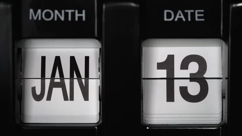 Flip calendar with date change thirteenth January to fourteenth January close up Stock Footage 274125043