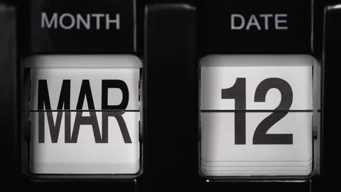 Flip calendar with date change from twelfth March to thirteenth March. close up. Stock-Footage 265574228