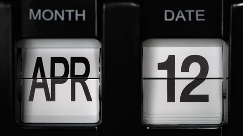 Flip calendar with date change from twelfth April to thirteenth April. close up. Stock Footage 266368697