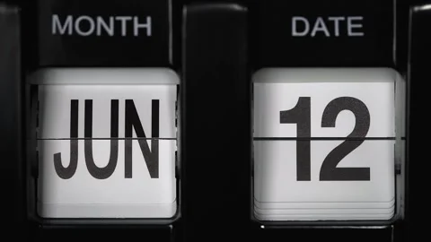 Flip calendar with date change twelfth of June to thirteenth of June. close up. Stock Footage 267934113