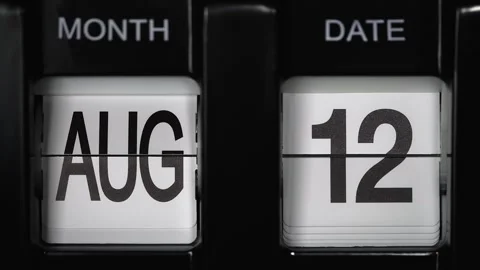 Flip calendar with date change from twelfth August to thirteenth August close up Stock Footage 269859417