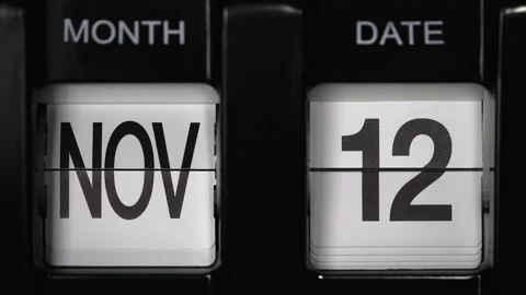 Flip calendar with date change twelfth November to thirteenth November. close up Stock Footage 271700690