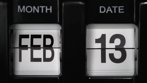 Flip calendar with date change twelfth February to thirteenth February. close up Stock Footage 272853200