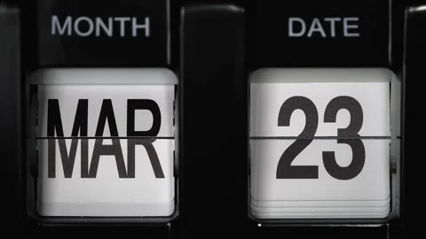 Flip calendar with date change twenty third March to twenty fourth March closeup Stock Footage 265820139