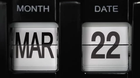 Flip calendar with date change twenty second March to twenty third March closeup Stock Footage 265820145