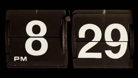 Flip clock changes from eight twenty nine to thirty Stock Footage 329667628