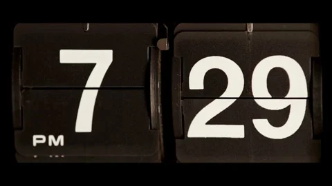 Flip clock changes from seven twenty nine to thirty Stock Footage 329667583