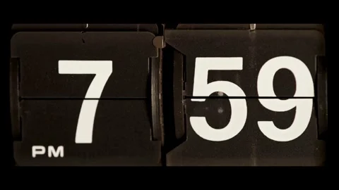 Flip clock changes time from 7 59 to 8 Stock Footage 329667639