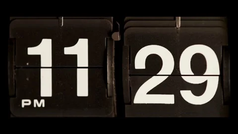 Flip clock changing time from eleven twenty nine pm Stock Footage 329667451
