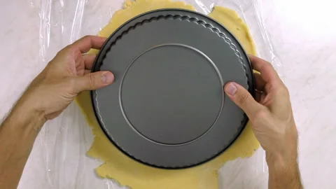 Flip dough sheet over baking tin Stock Footage 100195323