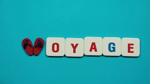 Flip flops and letters forming a word voyage. Stop motion Stock Footage 74249834