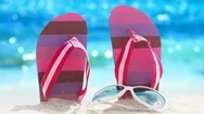 Flip-Flops And Sunglasses At The Tropical Beach Stock Footage
