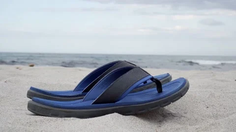 Flip Flops on the beach | 4K Stock Footage 220788997