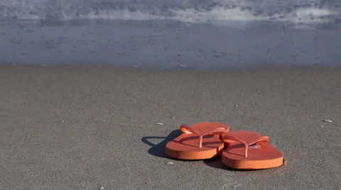 Flip-flops on the beach Stock Footage 54683486