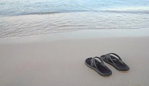 Flip-flops on the beach 스톡 사진