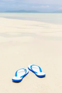 Flip flops on a beach Stock Photos