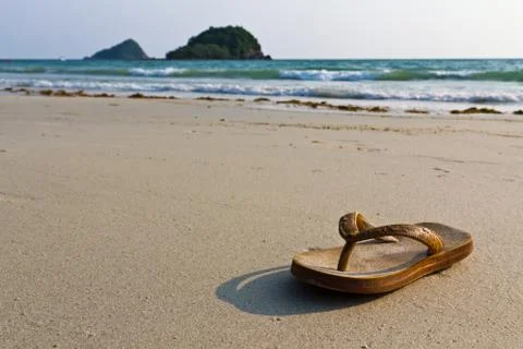 Flip-flops on the beach Stock Photos