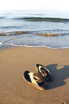 Flip flops on beach Stock Photos