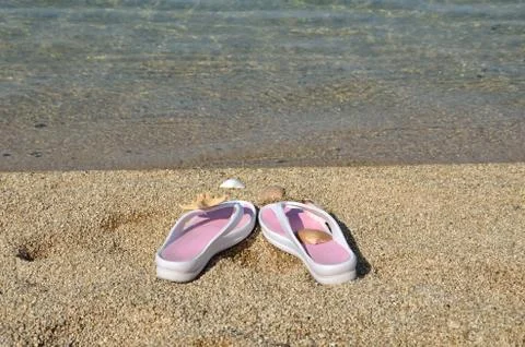 Flip flops on beach Stock Photos