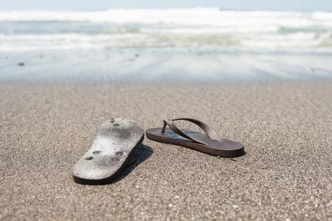 Flip flops on beach Stock Photos