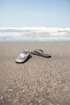 Flip flops on beach Stock Photos