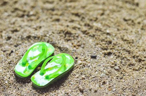 Flip flops on the beach Stock Photos