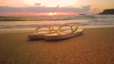 Flip Flops On The Beach At Sunset Stock Footage 137970596