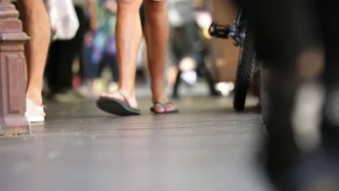 Flip flops in a busy street Stock Footage 82286424