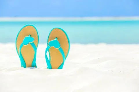 Flip Flops with hearts on a sandy beach Stock Photos