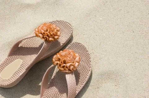 Flip-flops on sand Stock Photos