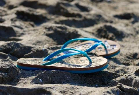 Flip flops on the sand. Stock Photos