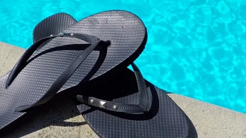 The flip flops by the swiming pool. Stock Footage 78723408