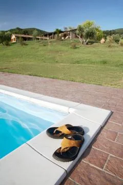 Flip-flops swimming-pool Stock Photos