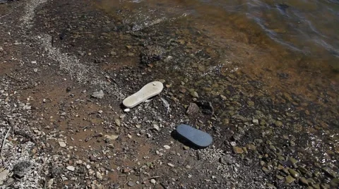 Flip Flops in the water. Stockbeeldmateriaal 68440198