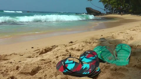 Flip Flops On Yellow Sandy Beach Near Sea Waves 스톡 동영상 61753017