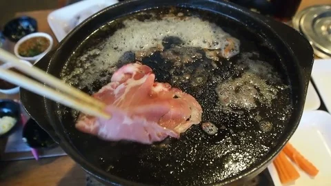 Flip over meat cooking BBQ, grilled sliced pork, beef on hot pan with butter Stock Footage 83921561