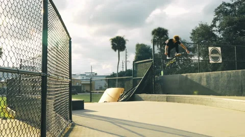 Flip Trick Over Huge Ledge At Outdoor Skatepark Video stock 168041070