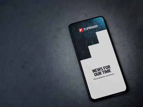 Flipboard app launch screen with logo on the display of a black mobile smartp Stock Photos