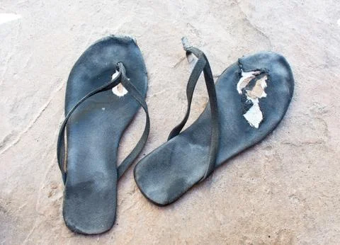 Flipflops torn distressed Stock Photos