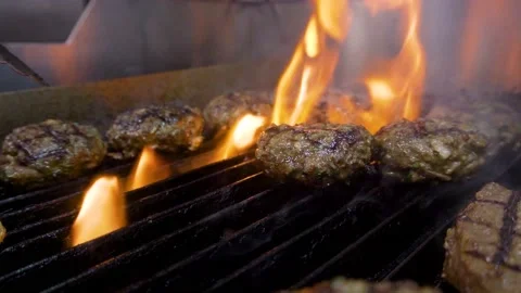 Fliping Grilled burger  Video stock 153720520