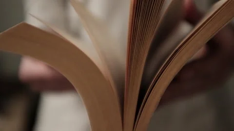 Flipping and old book with yellowed pages. Flicking through an old textbook. Stock Footage 321427352