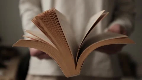 Flipping and old book with yellowed pages. Flicking through an old textbook. Stock Footage 321427355