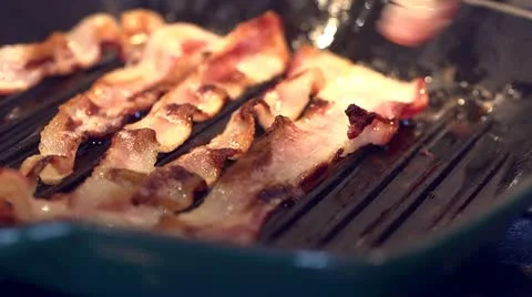 Flipping Bacon on Grill-Slow Motion Stock Footage 21958039