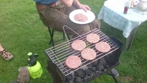 Flipping barbecue on the grill Stock Footage 72498426