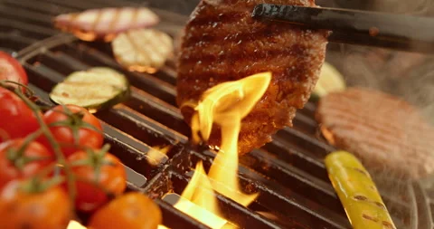 Flipping beef steak with tong Video stock 311829427