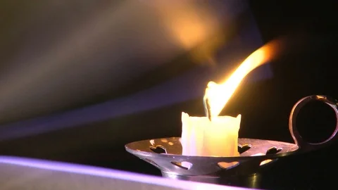 Flipping a book by candlelight Stockbeeldmateriaal 97639809