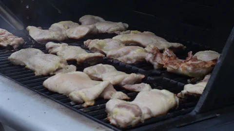 Flipping Chicken on the Grill 스톡 동영상 38010625