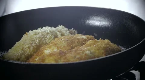 Flipping Chicken in Pan Video stock 61324686
